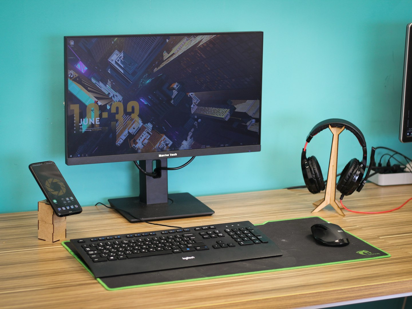 Modern workspace with a monitor displaying an online store or membership dashboard