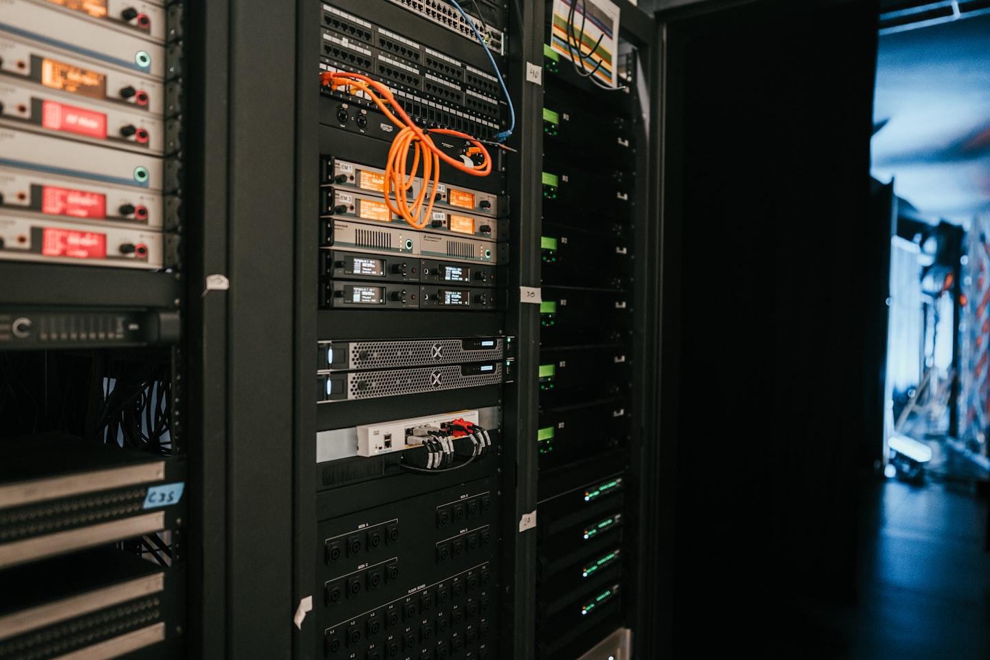 Engineer monitoring streaming infrastructure in a modern server room environment