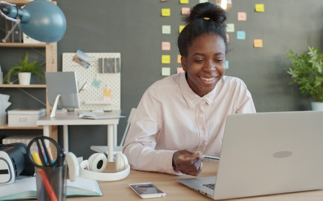 Developer working in a modern workspace with a video call interface on screen