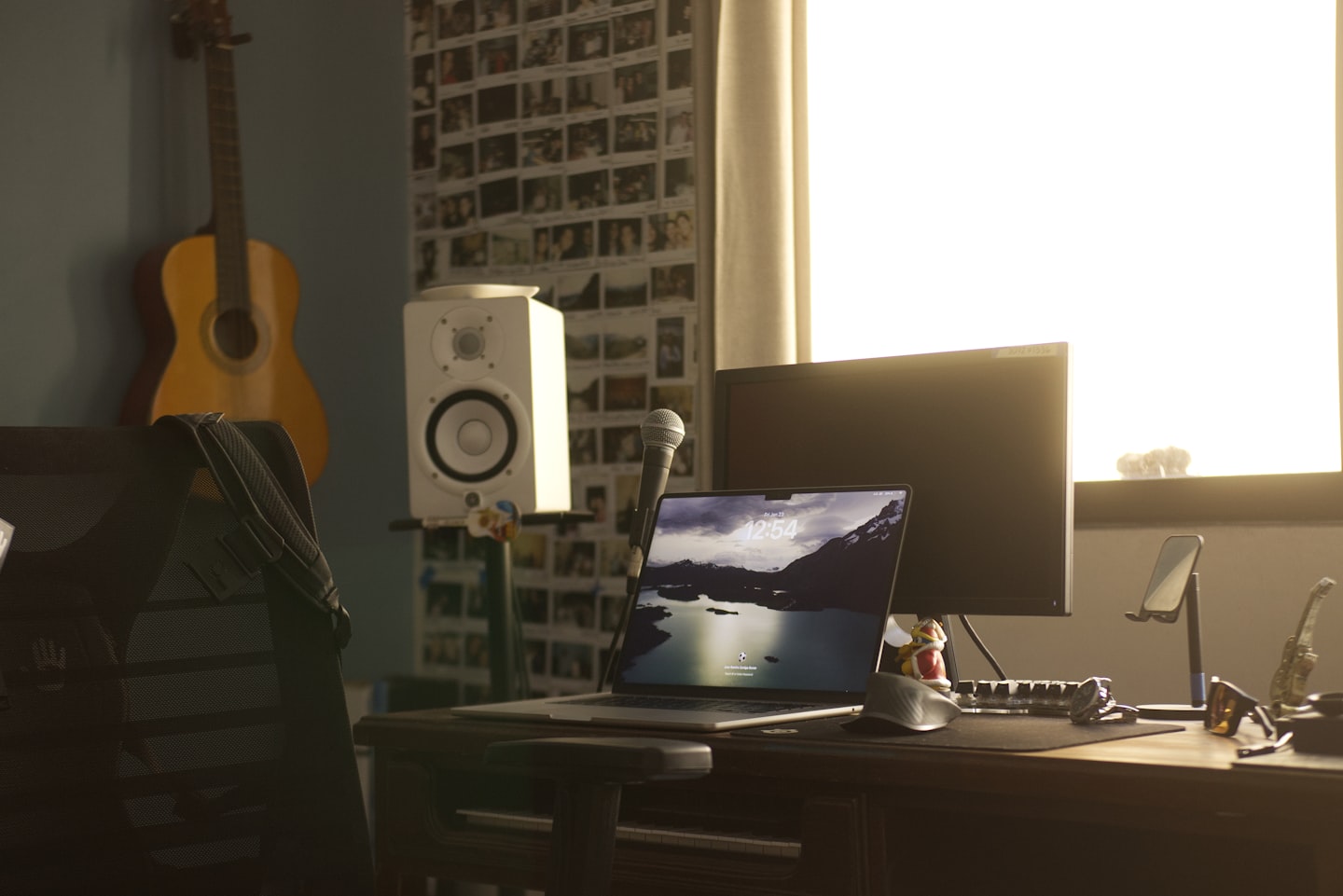 Laptop and monitor showing a live streaming website interface in a clean workspace