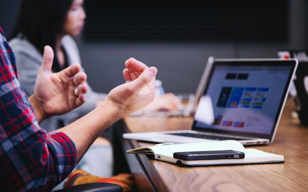 Professional team in a client meeting discussing a service plan in a bright modern office