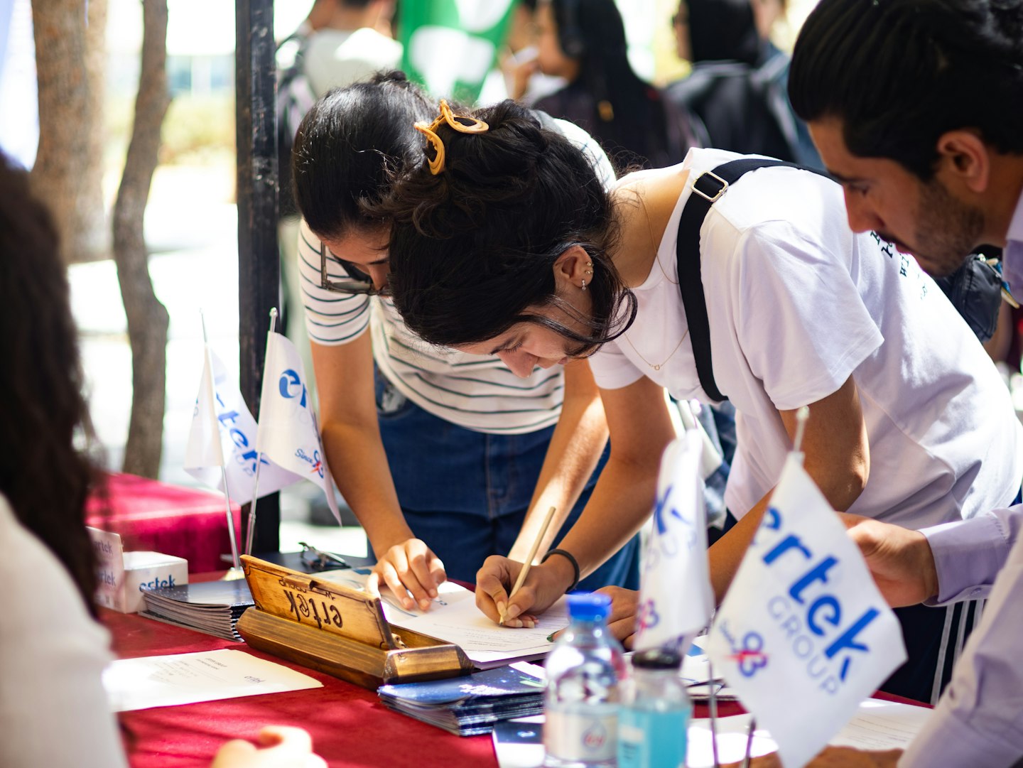 Guests checking in at an event reception desk with digital attendee registration